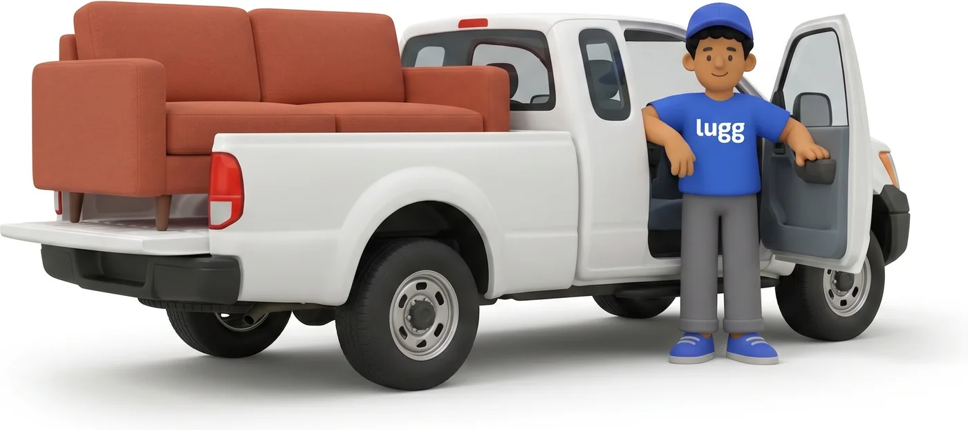 Lugger loading a sofa into a pickup truck