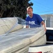 Lugg mover loading couch into pickup truck