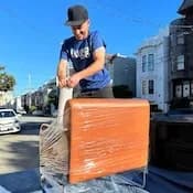 Lugg mover protecting a furniture delivery