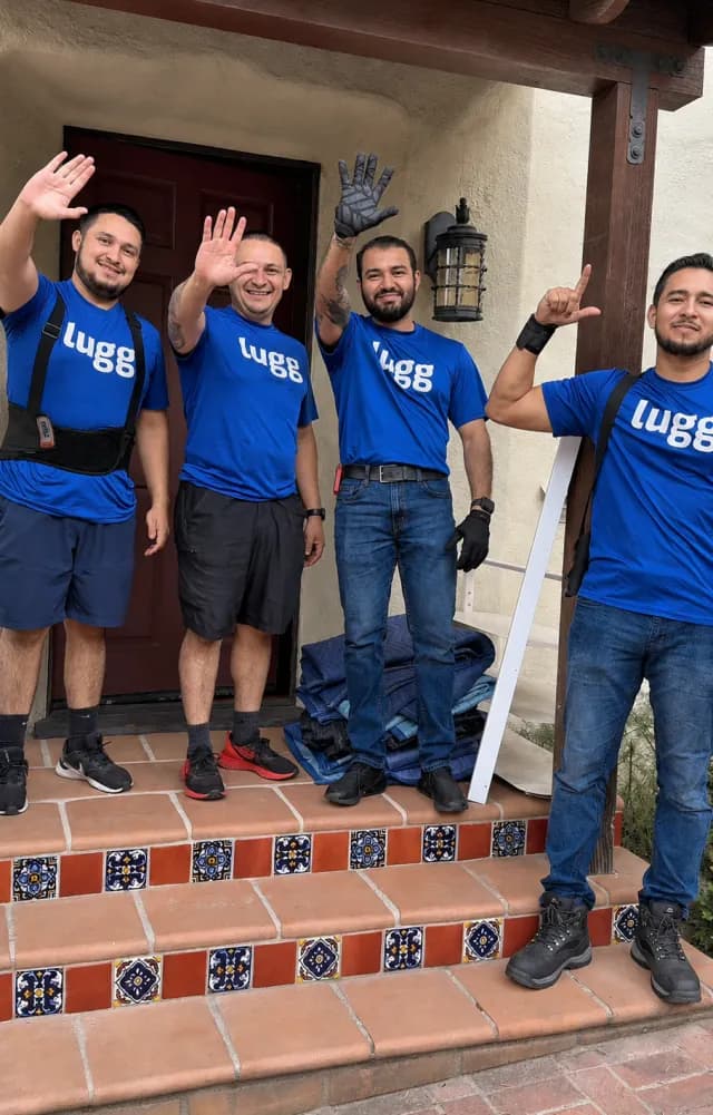 Crew of four Luggers waving on a front porch