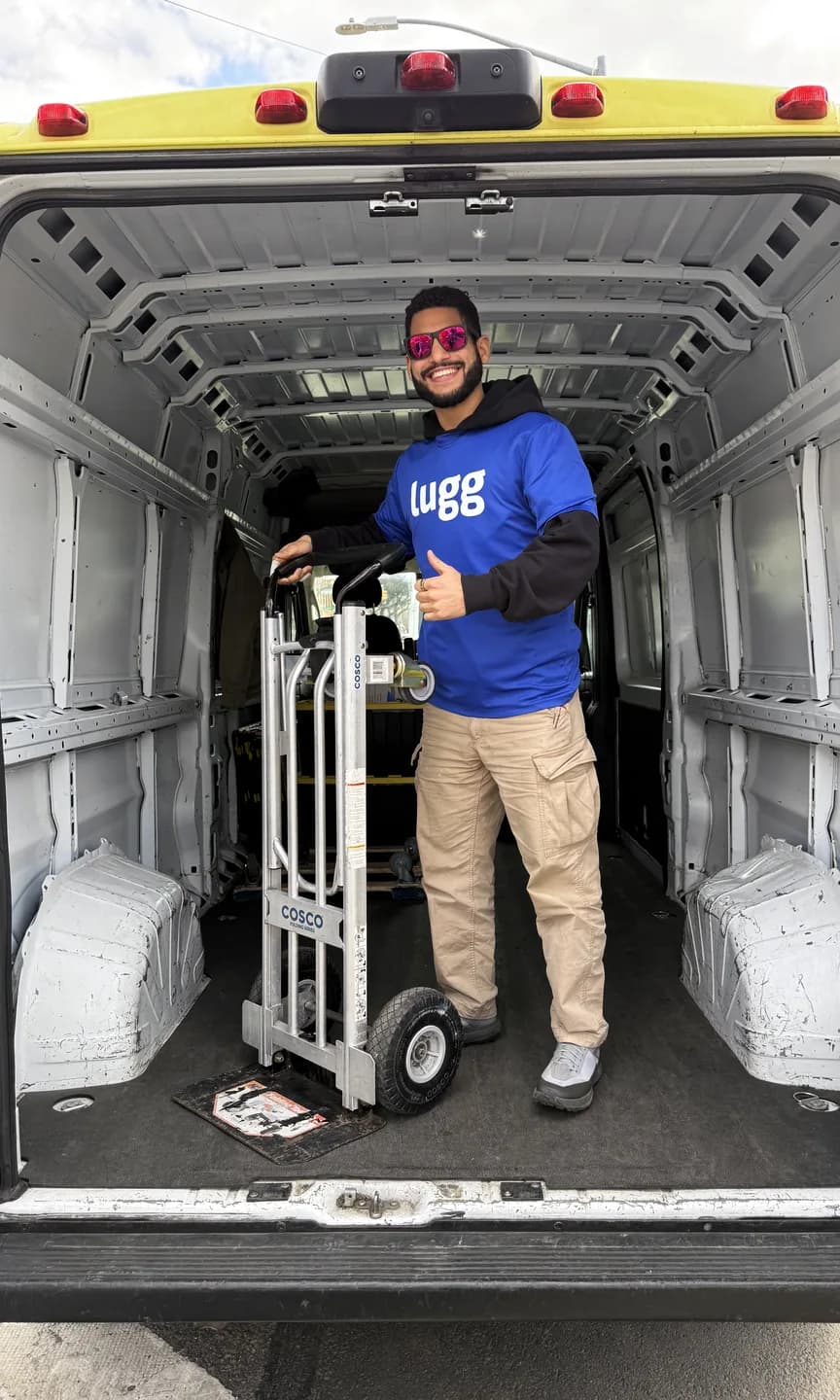 A Lugger with a hand truck in the back of a van