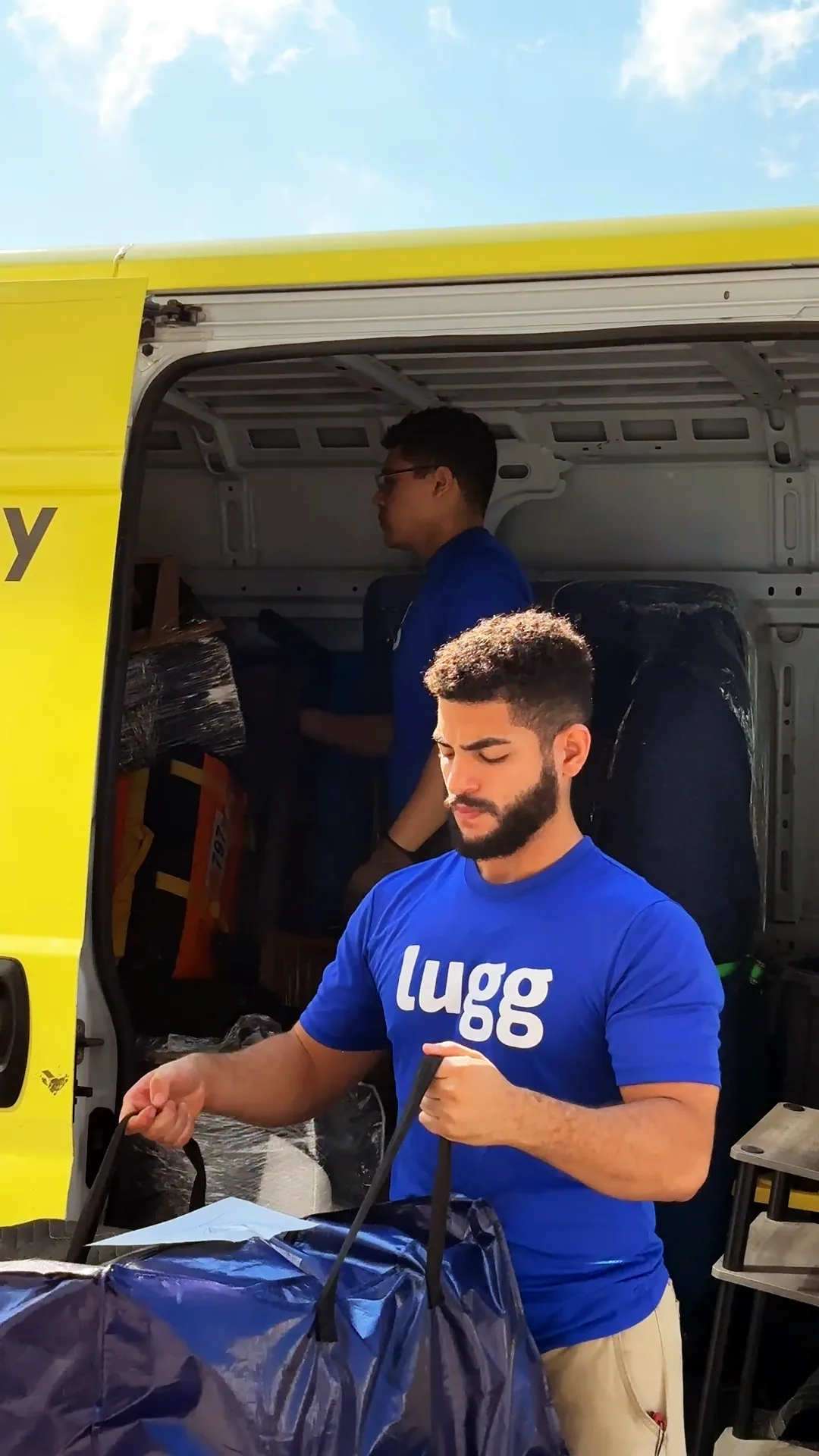 A Lugger unloading a bag from a van