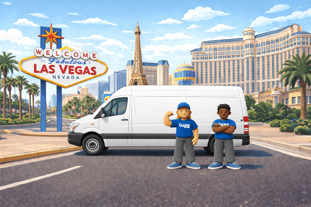 Lugg movers standing in front of a moving truck near the Welcome to Las Vegas sign, representing on-demand moving and delivery in Las Vegas.
