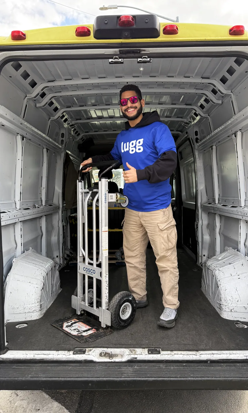 A Lugger with a hand truck in the back of a van