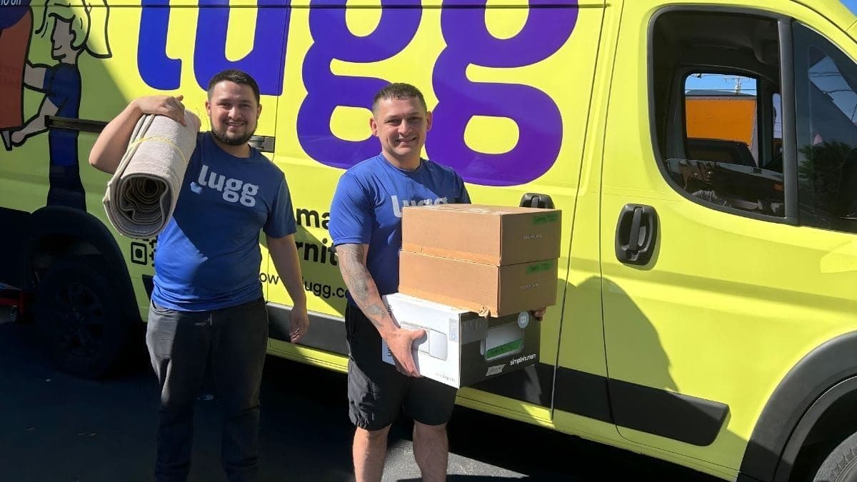 Two Lugg movers in branded tees loading furniture and boxes into a Lugg Sprinter van — one option for Amazon driver jobs alternatives