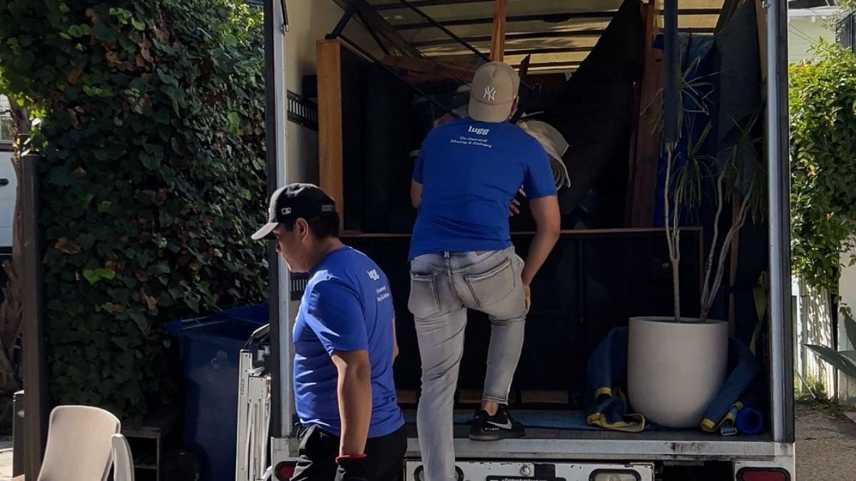 Lugg movers loading large items into a box truck, one of six Lugg vehicle sizes.