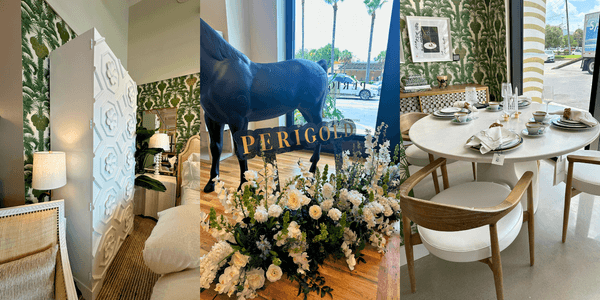 Perigold Houston store entrance with floral display, large black horse statue, and signage visible through floor-to-ceiling windows.